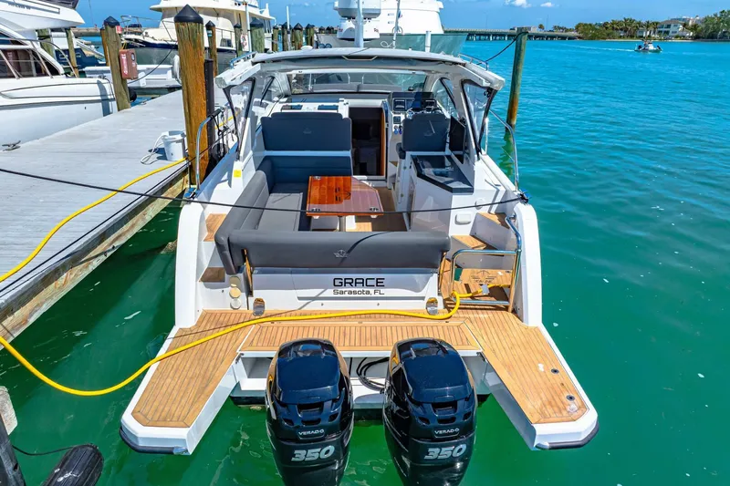  Yacht Photos Pics 2019 Sealine S330V yacht docked, featuring twin 350 engines and spacious seating area.