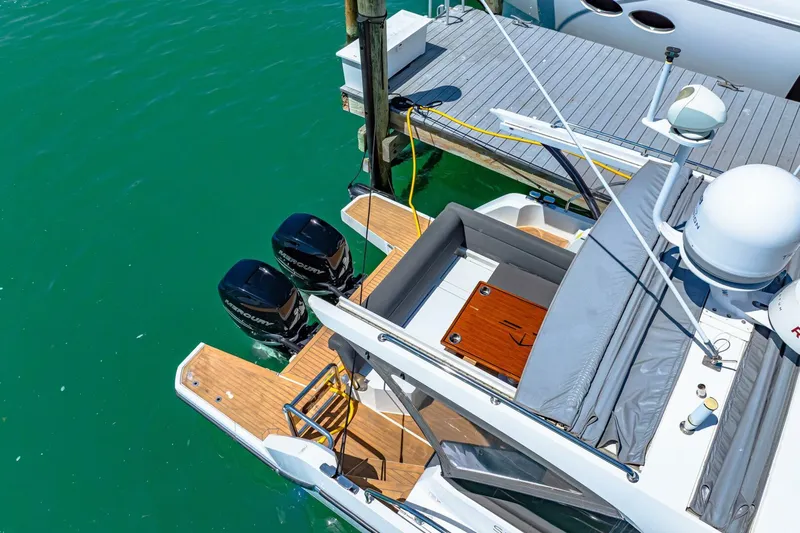  Yacht Photos Pics 2019 Sealine S330V boat docked with twin outboard motors, aerial view.