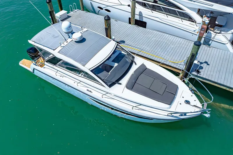  Yacht Photos Pics 2019 Sealine S330V yacht docked in turquoise water, aerial view.