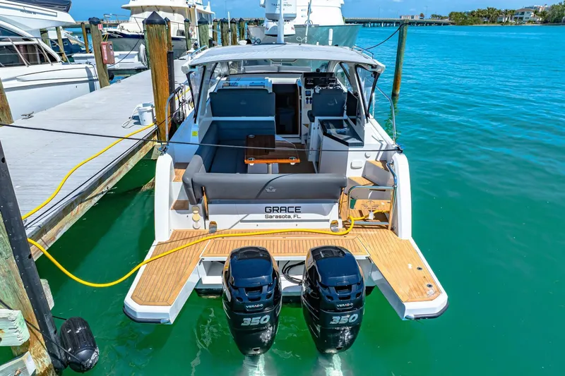  Yacht Photos Pics 2019 Sealine S330V yacht docked with twin 350 engines, turquoise water background.