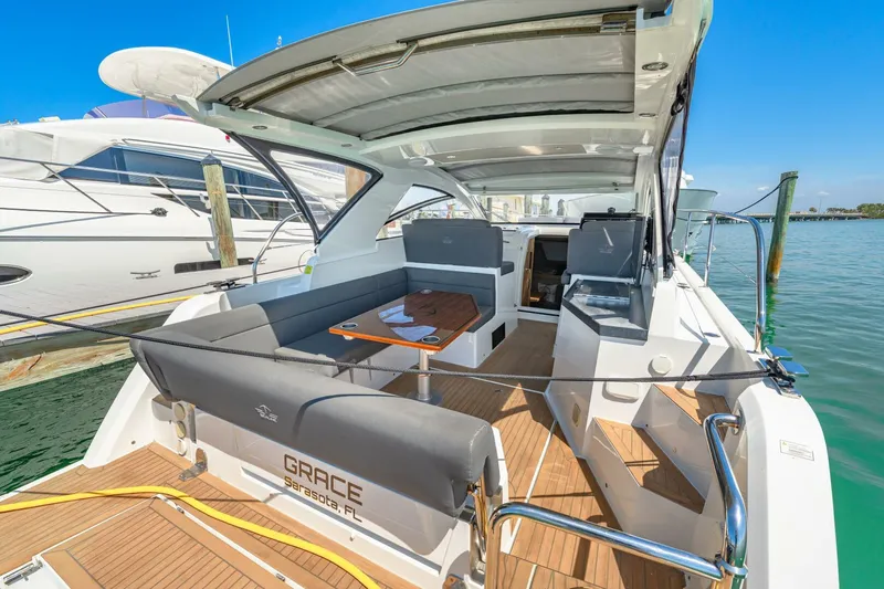  Yacht Photos Pics 2019 Sealine S330V yacht with spacious deck, modern seating, and elegant design docked at marina.