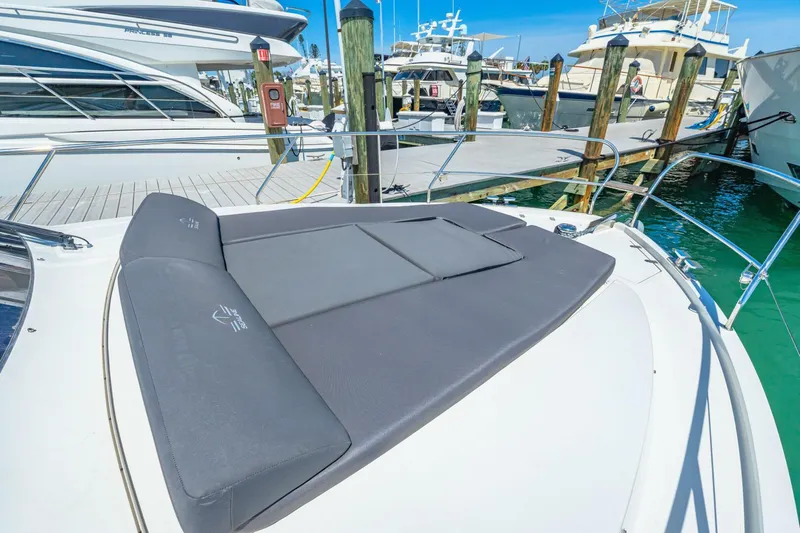  Yacht Photos Pics 2019 Sealine S330V yacht with sunbathing area, docked at marina.