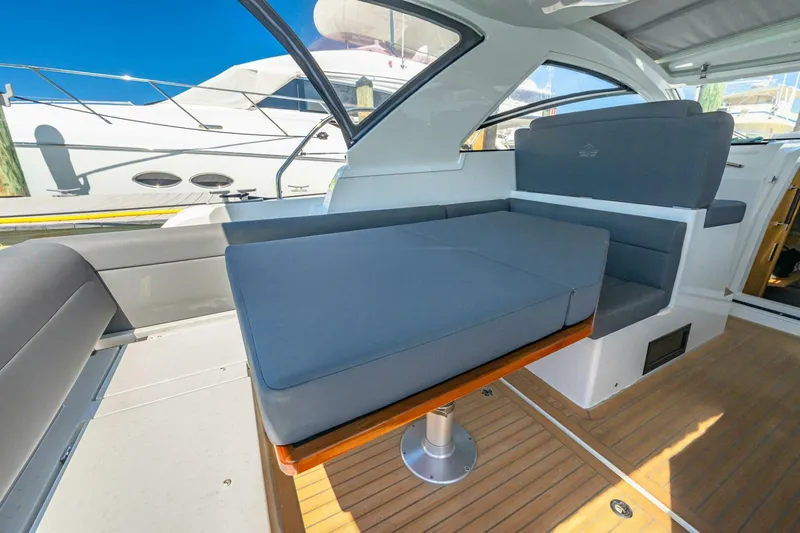  Yacht Photos Pics 2019 Sealine S330V yacht interior with modern seating and wooden flooring.