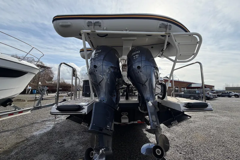  Yacht Photos Pics 2023 Cutwater C-32 Coupe with dual 300 V6 outboard engines, rear view.