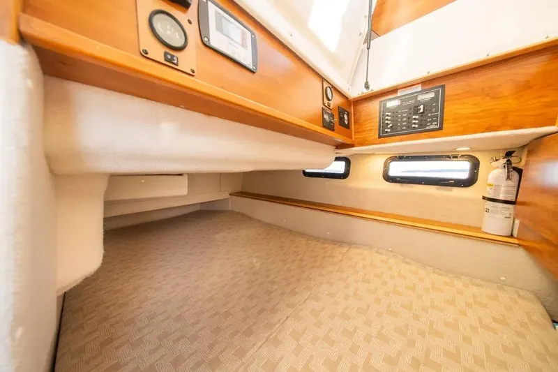 Yacht Photos Pics 2023 Cutwater C-32 Coupe cabin interior with control panels and windows.