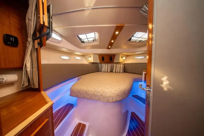 Yacht Photos Pics 2023 Cutwater C-32 Coupe interior cabin with ambient lighting and modern design.