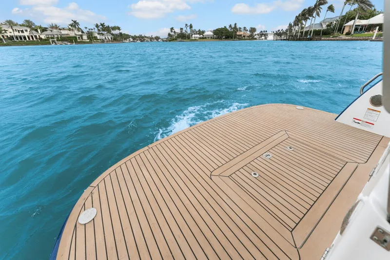 Annabelle IV Yacht Photos Pics 2024 MJM 42 boat deck overlooking clear blue water and distant shoreline.