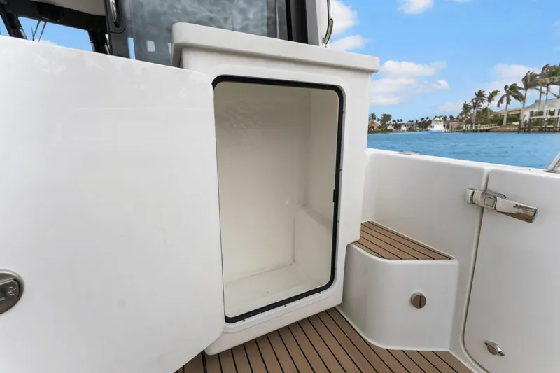 Annabelle IV Yacht Photos Pics Open storage compartment on 2024 MJM 42 boat, with ocean view in background.