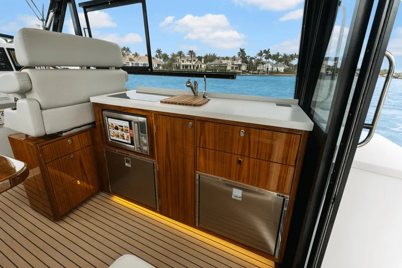 Annabelle IV Yacht Photos Pics Luxurious interior of 2024 MJM 42 yacht with modern kitchenette and scenic ocean view.