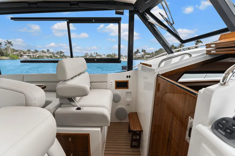 Annabelle IV Yacht Photos Pics Luxurious interior of 2024 MJM 42 yacht with plush seating and scenic ocean view.