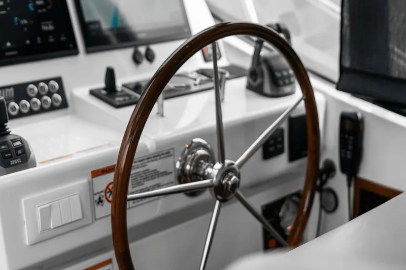 Annabelle IV Yacht Photos Pics Steering wheel of 2024 MJM 42 yacht, featuring modern navigation controls and sleek design.