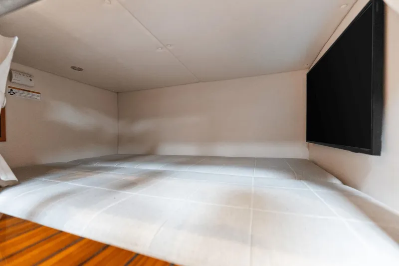 Annabelle IV Yacht Photos Pics 2024 MJM 42 interior cabin with bed and wall-mounted TV.