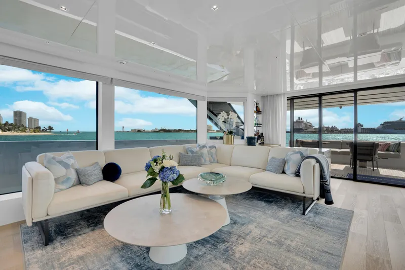 Sweet Virginia Yacht Photos Pics Luxurious interior of 2023 Sanlorenzo SL96A yacht with ocean view and elegant furnishings.