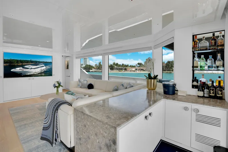 Sweet Virginia Yacht Photos Pics Luxurious interior of 2023 Sanlorenzo SL96A yacht with elegant seating and bar area.