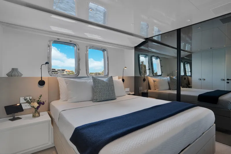 Sweet Virginia Yacht Photos Pics Luxurious bedroom interior of 2023 Sanlorenzo SL96A yacht with elegant decor and ocean view.