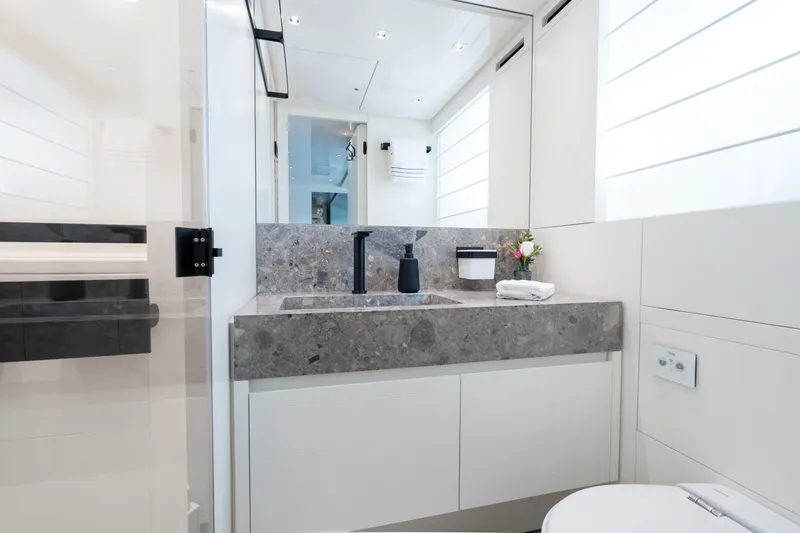 Sweet Virginia Yacht Photos Pics Luxurious bathroom in 2023 Sanlorenzo SL96A yacht with modern fixtures and elegant design.