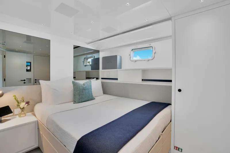Sweet Virginia Yacht Photos Pics Luxurious bedroom interior of 2023 Sanlorenzo SL96A yacht with modern design and cozy bedding.