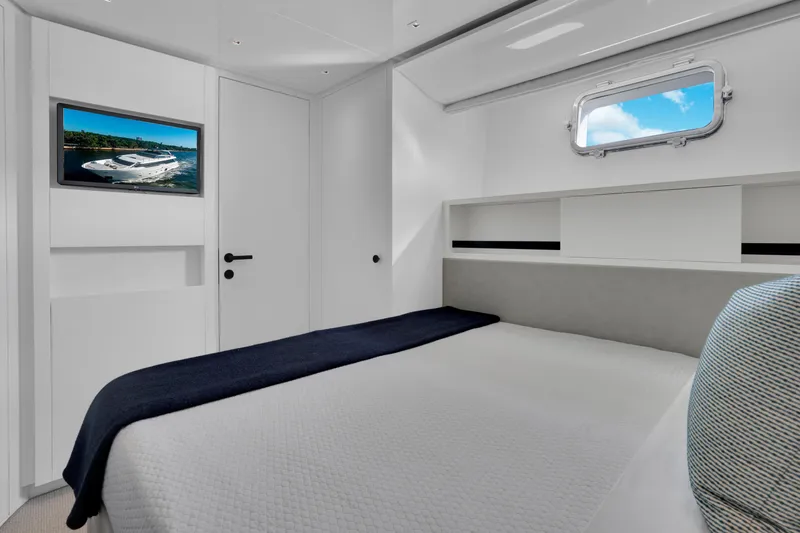 Sweet Virginia Yacht Photos Pics Luxurious 2023 Sanlorenzo SL96A yacht bedroom with modern decor and window view.