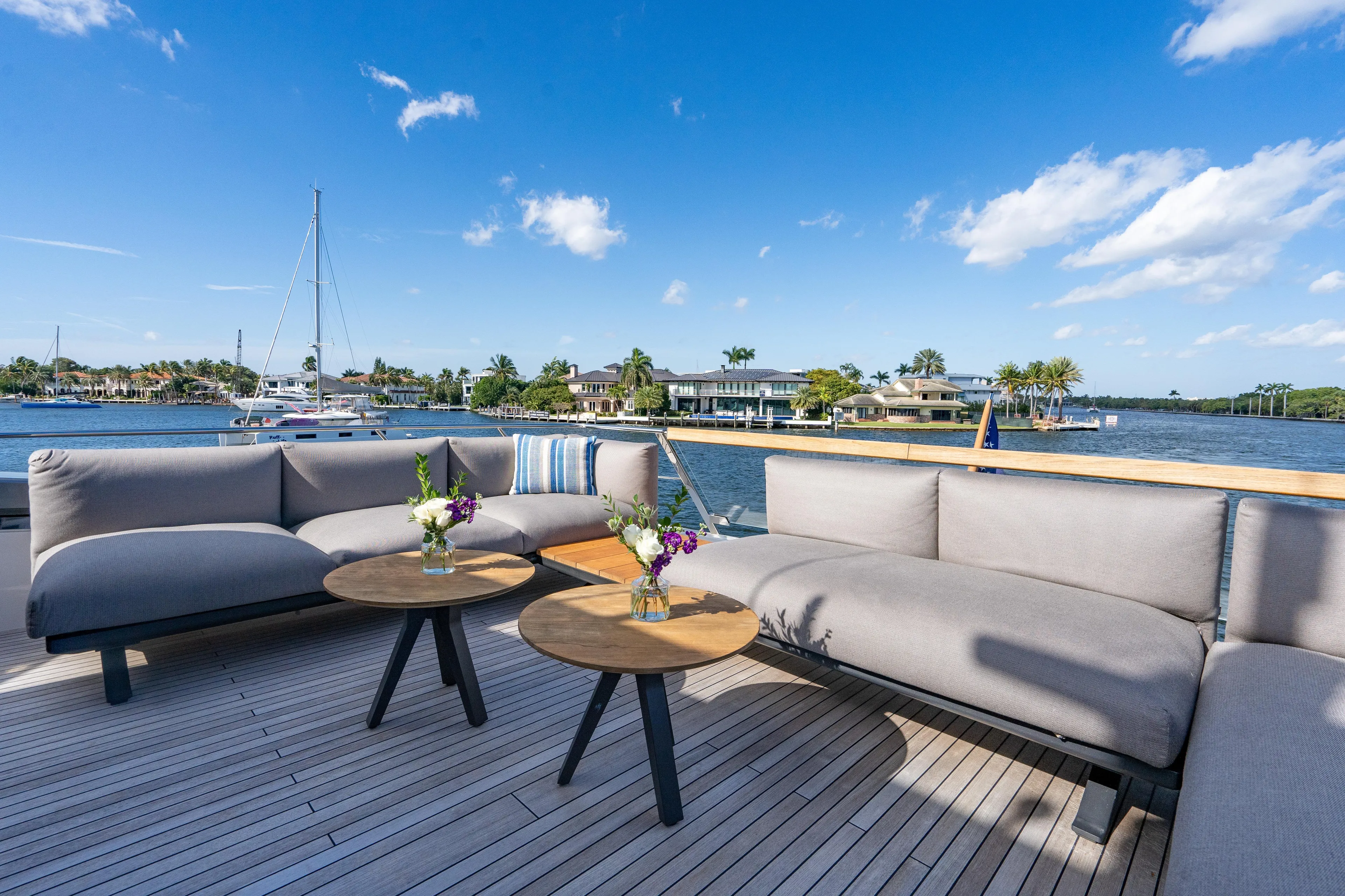 Sweet Virginia Yacht Photos Pics Luxurious 2023 Sanlorenzo SL96A yacht deck with elegant seating and scenic waterfront view.