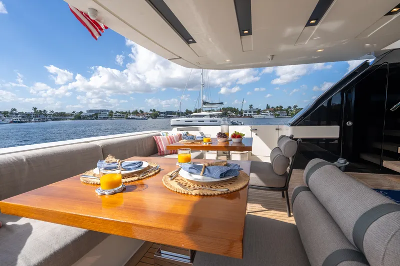 Sweet Virginia Yacht Photos Pics Luxurious 2023 Sanlorenzo SL96A yacht deck with elegant dining setup and ocean view.