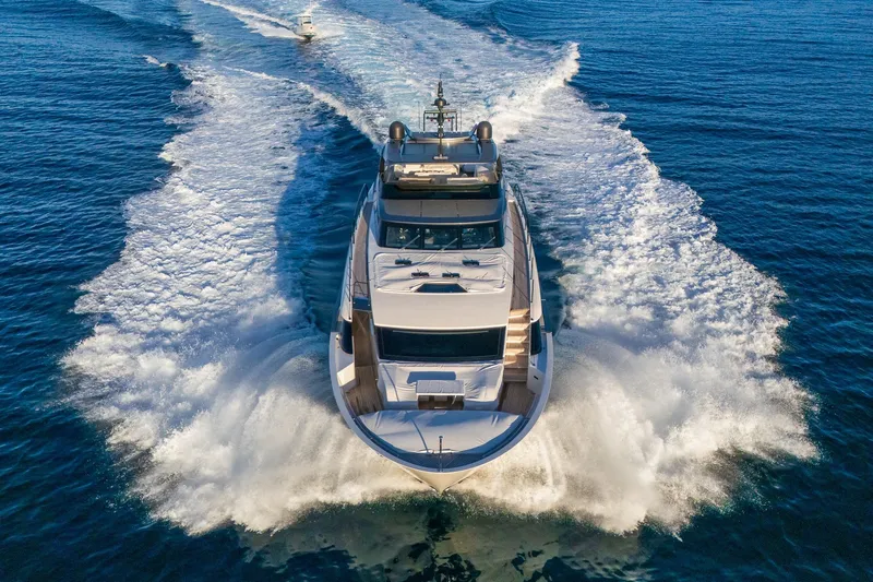 Sweet Virginia Yacht Photos Pics Luxurious 2023 Sanlorenzo SL96A yacht cruising on open sea, creating dynamic water trails.
