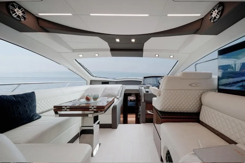  Yacht Photos Pics Luxurious interior of 2025 Cobrey 50 FLY yacht with elegant seating and modern design.