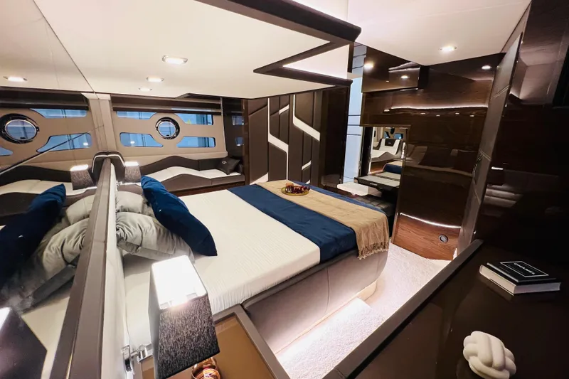  Yacht Photos Pics Luxurious bedroom interior of 2025 Cobrey 50 FLY yacht with modern design and elegant furnishings.