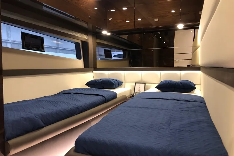  Yacht Photos Pics Luxurious interior of 2025 Cobrey 50 FLY yacht with twin beds and modern design.