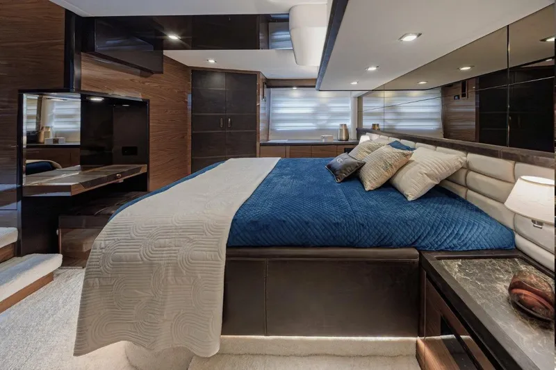  Yacht Photos Pics Luxurious bedroom interior of 2025 Cobrey 50 FLY yacht with modern design and elegant furnishings.