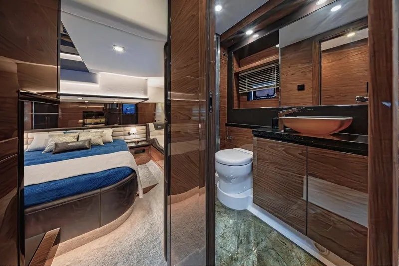  Yacht Photos Pics Luxurious interior of 2025 Cobrey 50 FLY yacht with elegant bedroom and bathroom.