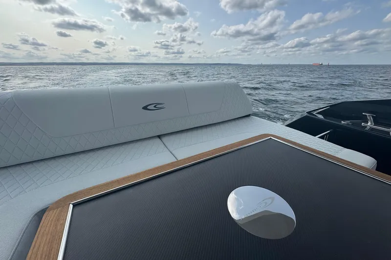  Yacht Photos Pics Luxurious 2025 Cobrey 50 FLY yacht interior with ocean view and elegant seating.