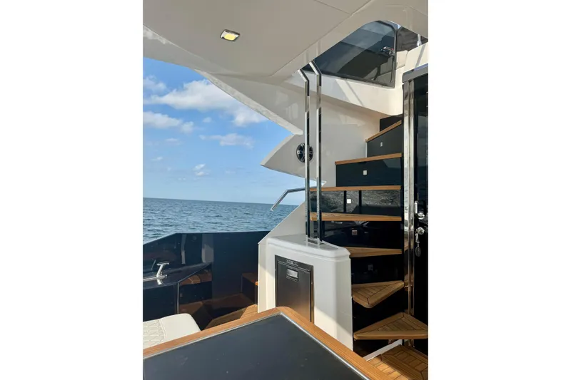  Yacht Photos Pics Luxurious Cobrey 50 FLY yacht interior with elegant staircase, ocean view, 2025 model.