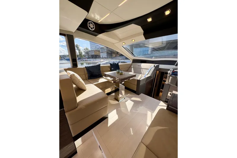  Yacht Photos Pics Luxurious interior of 2025 Cobrey 50 FLY yacht with elegant seating and modern design.