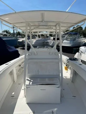  Yacht Photos Pics 2006 Jupiter 31 Center Console boat with T-top, docked in a marina.