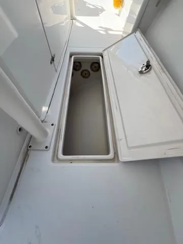  Yacht Photos Pics Open storage compartment on a 2006 Jupiter 31 Center Console boat.