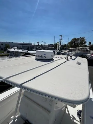  Yacht Photos Pics 2006 Jupiter 31 Center Console boat with Garmin radar, docked in a marina.