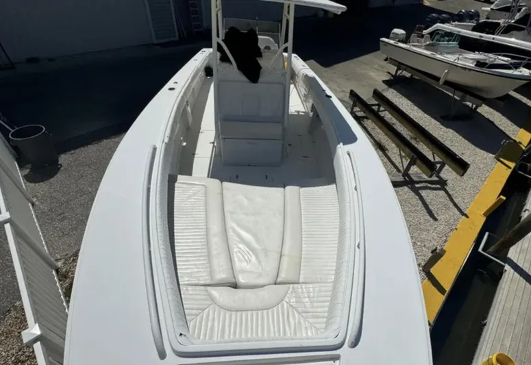  Yacht Photos Pics 2006 Jupiter 31 Center Console boat with white seating and spacious deck.