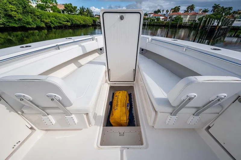  Yacht Photos Pics 2016 Invincible 39 Open Fisherman boat interior with seating and storage compartment.