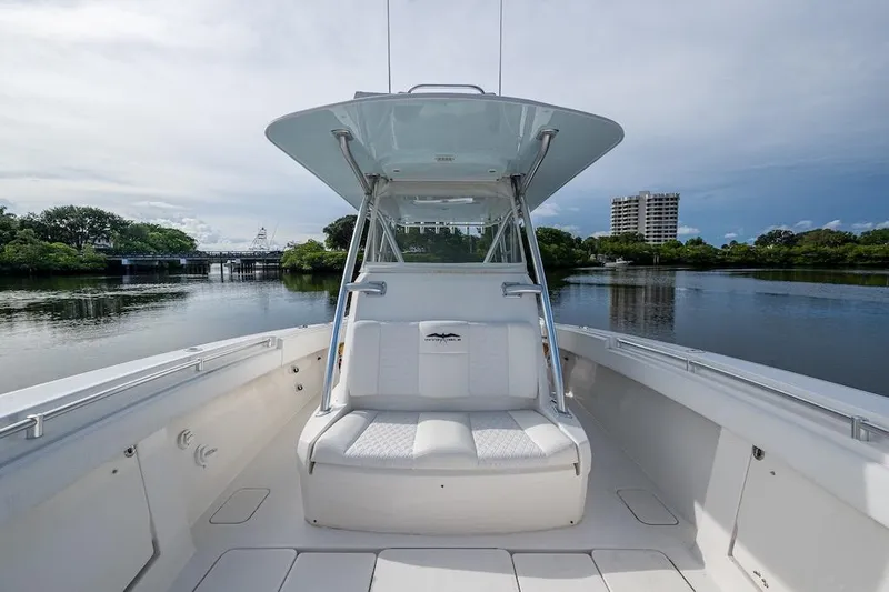  Yacht Photos Pics 2016 Invincible 39 Open Fisherman boat on calm water, featuring sleek design and spacious seating.