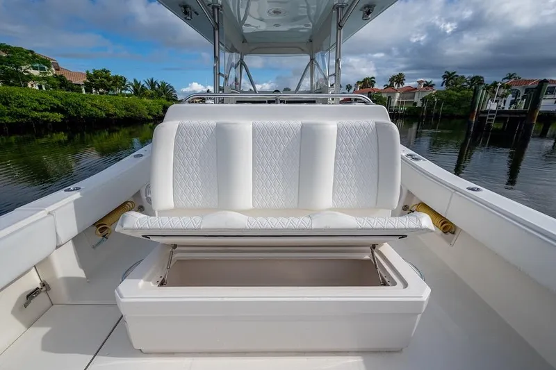  Yacht Photos Pics 2016 Invincible 39 Open Fisherman boat with open storage under white cushioned seat.