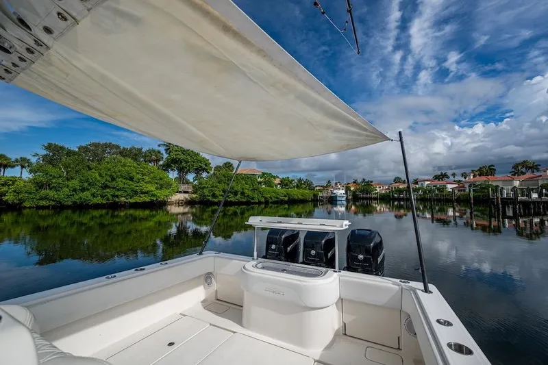  Yacht Photos Pics 2016 Invincible 39 Open Fisherman boat on calm water with scenic view.