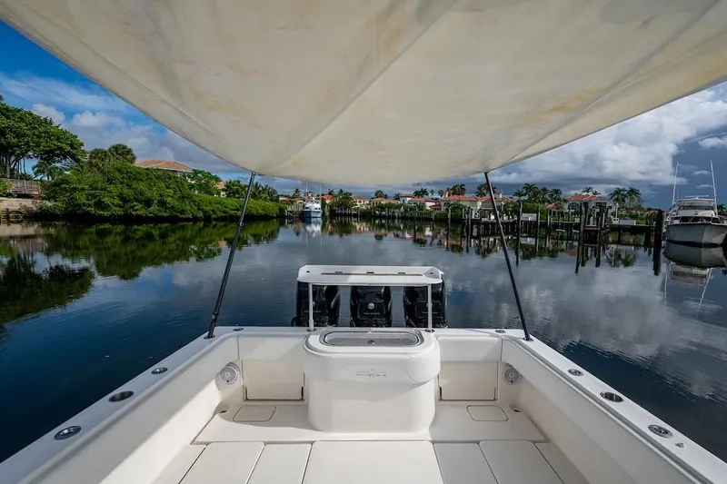  Yacht Photos Pics Invincible 39 Open Fisherman boat on calm water, 2016 model, scenic view.