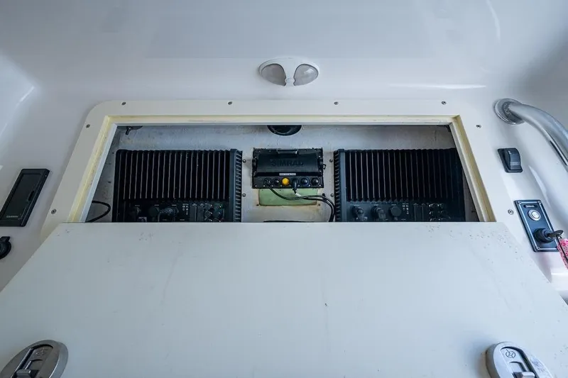  Yacht Photos Pics Electronics compartment of 2016 Invincible 39 Open Fisherman boat, featuring Simrad equipment.
