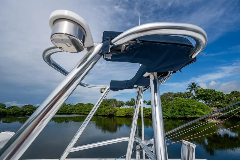  Yacht Photos Pics 2016 Invincible 39 Open Fisherman boat detail with clear sky and lush greenery background.