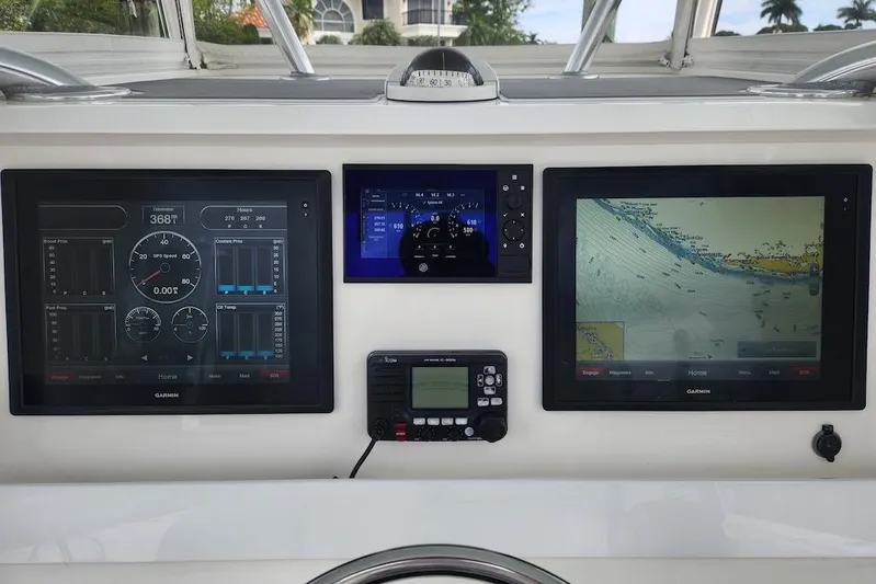  Yacht Photos Pics Dashboard of a 2016 Invincible 39 Open Fisherman with navigation and control screens.