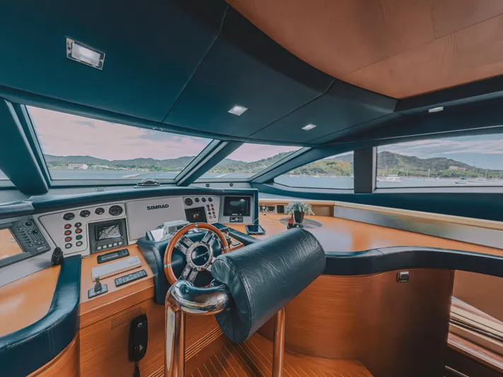 Camy Ed Yacht Photos Pics Luxurious helm of 2006 Azimut 105 Grande yacht with modern controls and panoramic view.