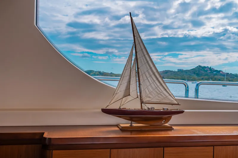 Camy Ed Yacht Photos Pics Model sailboat displayed inside 2006 Azimut 105 Grande yacht, with scenic ocean view.