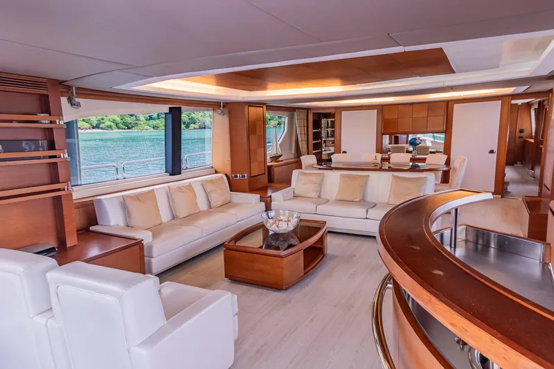 Camy Ed Yacht Photos Pics Luxurious interior of 2006 Azimut 105 Grande yacht with elegant seating and wooden accents.