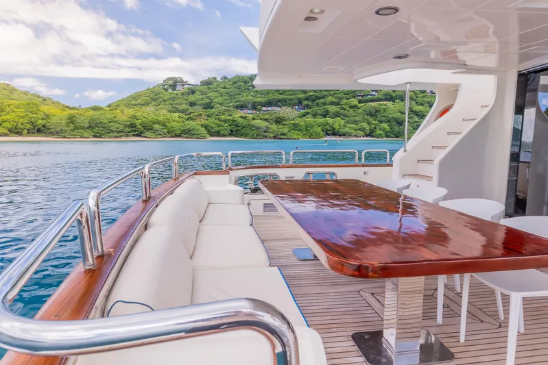 Camy Ed Yacht Photos Pics Luxurious 2006 Azimut 105 Grande yacht deck with elegant seating and scenic ocean view.