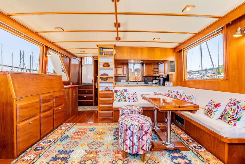 Si Como No Yacht Photos Pics Luxurious 2009 DeFever 45 Motoryacht interior with vibrant decor and spacious seating area.